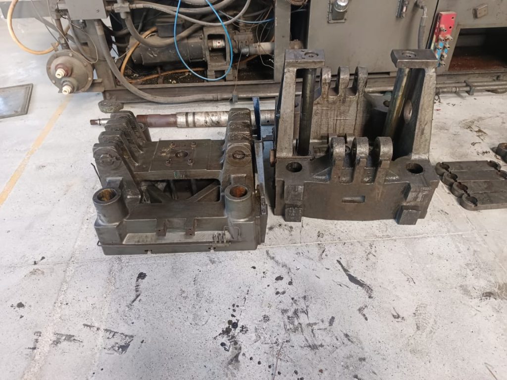 molding machine repair technician working